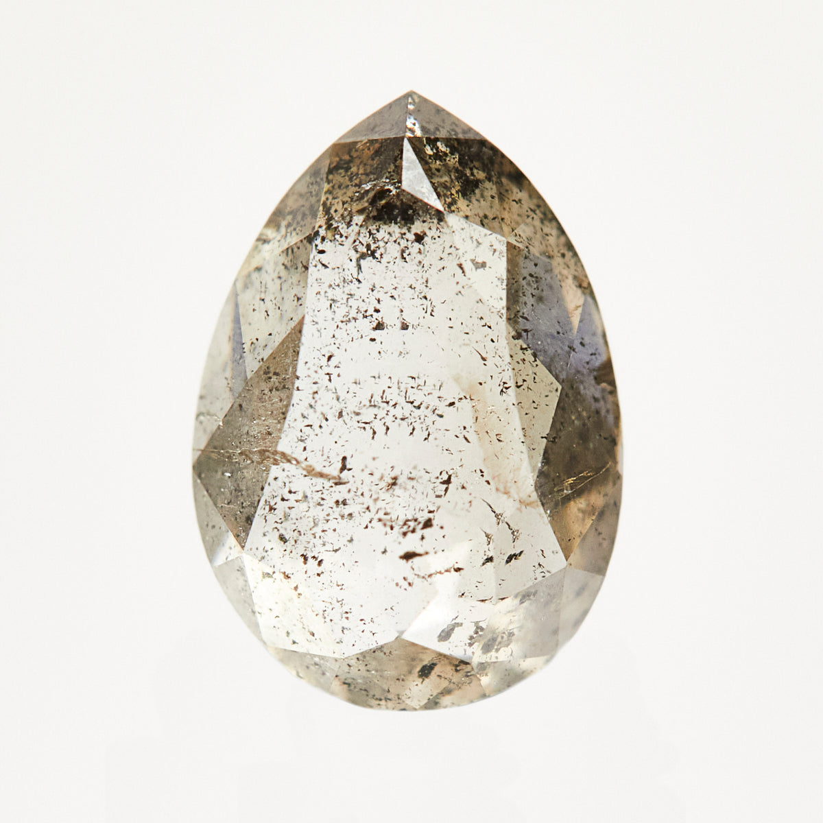 One-of-a-kind pear-shaped rose-cut salt and pepper diamond with unique inclusions.