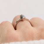 elongated hexagon salt and pepper diamond trilogy engagement ring
