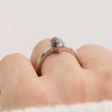 elongated hexagon salt and pepper diamond trilogy engagement ring
