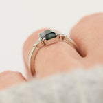 emerald cut blue teal sapphire trilogy engagement ring in platinum