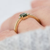 emerald cut green sapphire ring in yellow gold