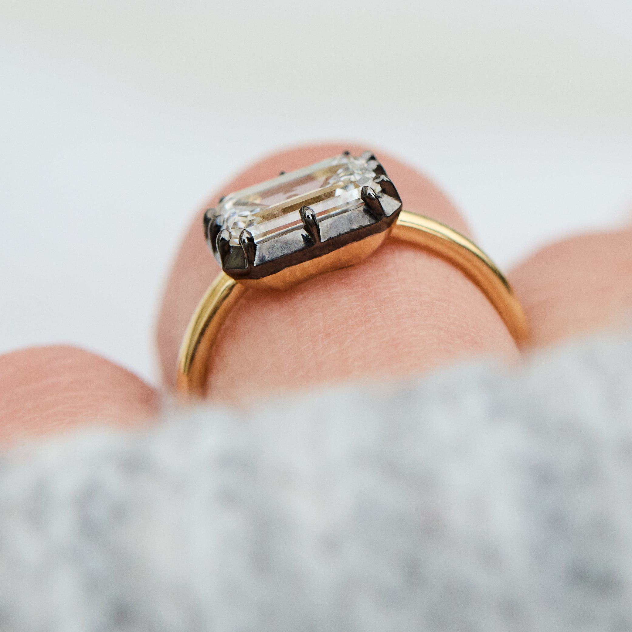 emerald cut lab grown diamond engagement ring east west setting