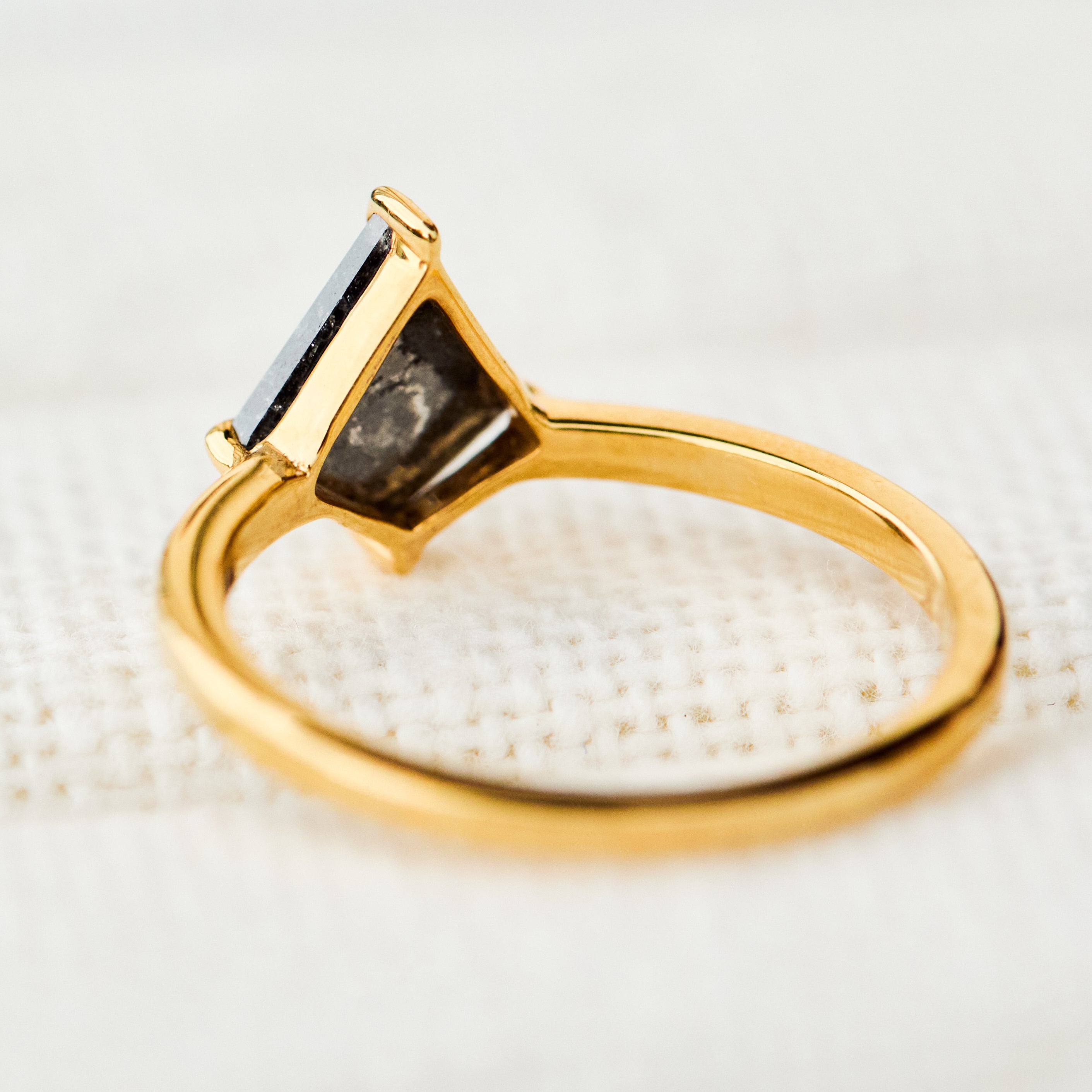 kite shape dark salt and pepper diamond solitaire engagement ring in yellow gold