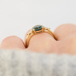 oval australian teal sapphire trilogy engagement ring in yellow gold