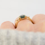 oval australian teal sapphire trilogy engagement ring in yellow gold
