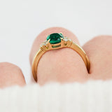 oval emerald yellow gold engagement ring with six round side diamonds