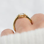 oval lab grown diamond yellow gold trilogy engagement ring