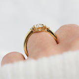 oval lab grown diamond yellow gold trilogy engagement ring