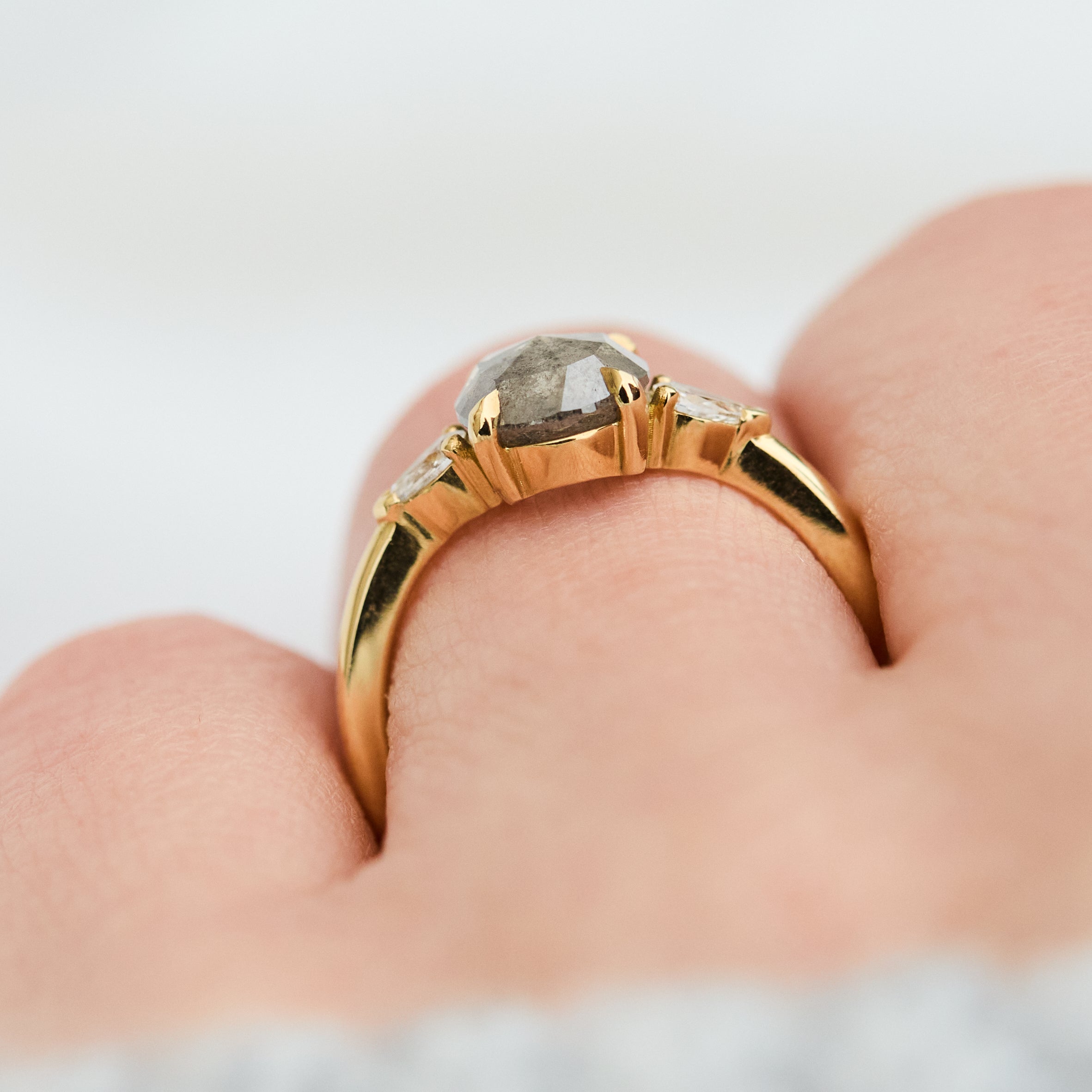 oval rose cut salt and pepper diamond engagement trilogy ring in yellow gold