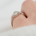 platinum pear shape rose cut salt and pepper diamond trilogy engagement ring