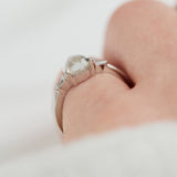 platinum pear shape rose cut salt and pepper diamond trilogy engagement ring