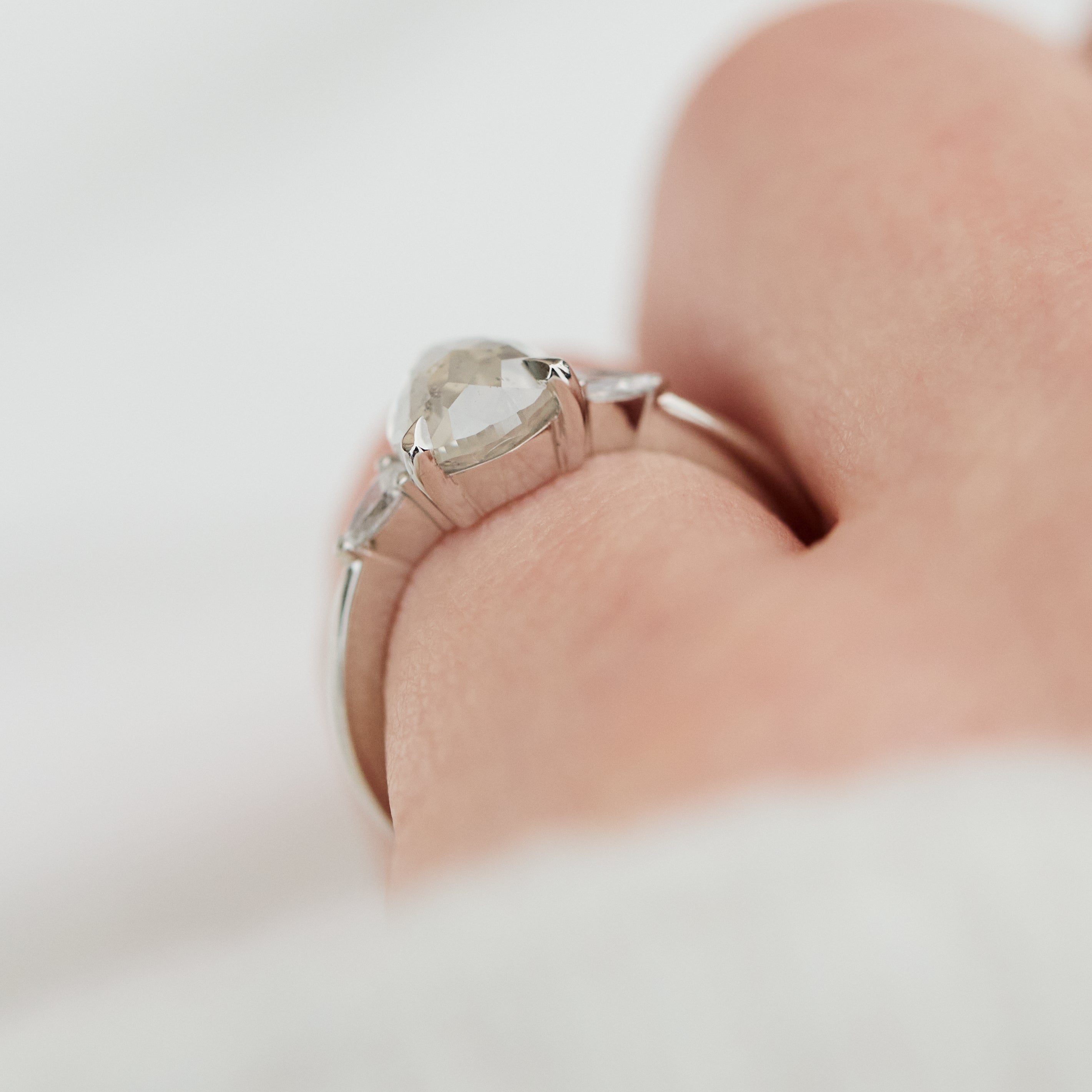 platinum pear shape rose cut salt and pepper diamond trilogy engagement ring