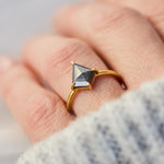 yellow gold solitaire ring with a kite shape salt and pepper diamond
