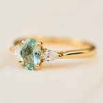 montana oval sapphire trilogy yellow gold engagement ring