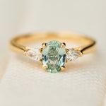 montana oval sapphire trilogy yellow gold engagement ring