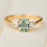 montana oval sapphire trilogy yellow gold engagement ring
