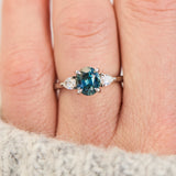 oval blue teal sapphire platinum trilogy engagement ring