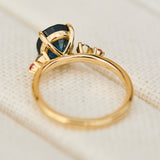oval blue teal sapphire yellow gold engagement ring with four side stones