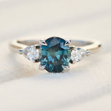 oval blue teal sapphire platinum trilogy engagement ring