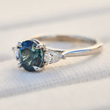 oval blue teal sapphire platinum trilogy engagement ring