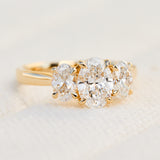 oval diamonds trilogy engagement ring set in 18ct yellow gold