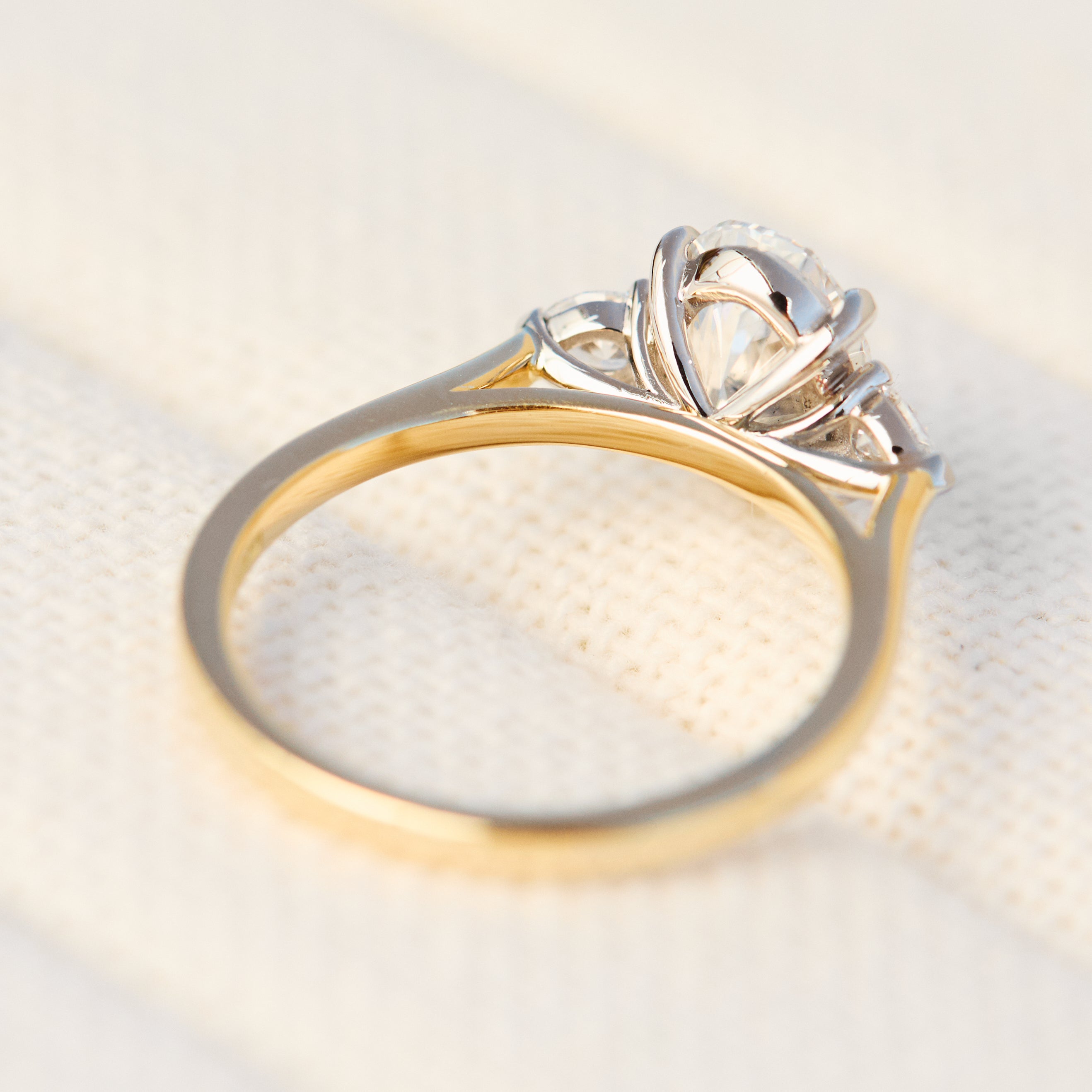 oval lab grown diamond yellow gold and platinum engagement ring