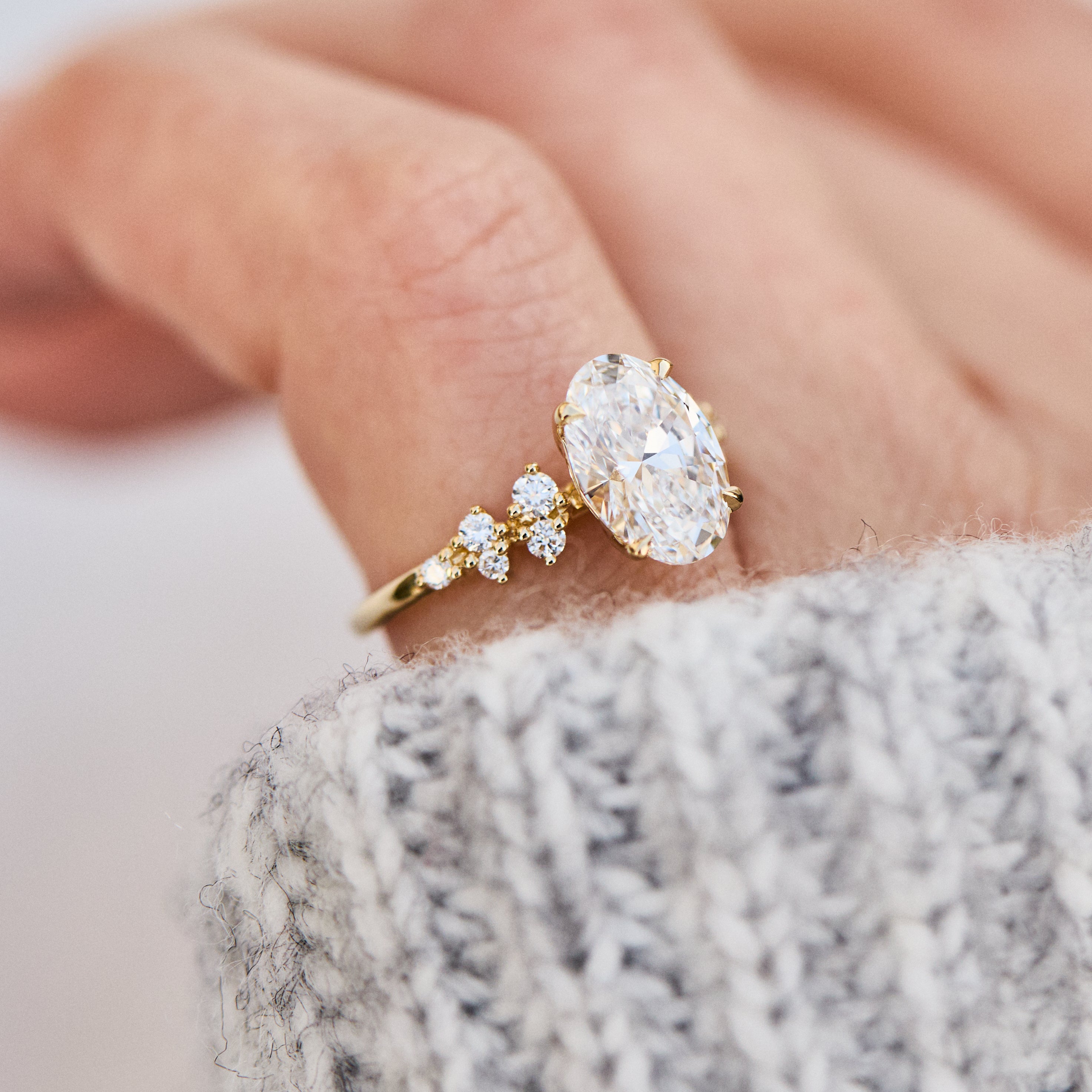 oval lab grown diamond yellow gold engagement cluster ring