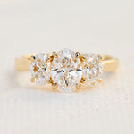 oval diamonds trilogy engagement ring set in 18ct yellow gold