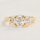 oval diamonds trilogy engagement ring set in 18ct yellow gold