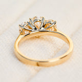 oval diamonds trilogy engagement ring set in 18ct yellow gold