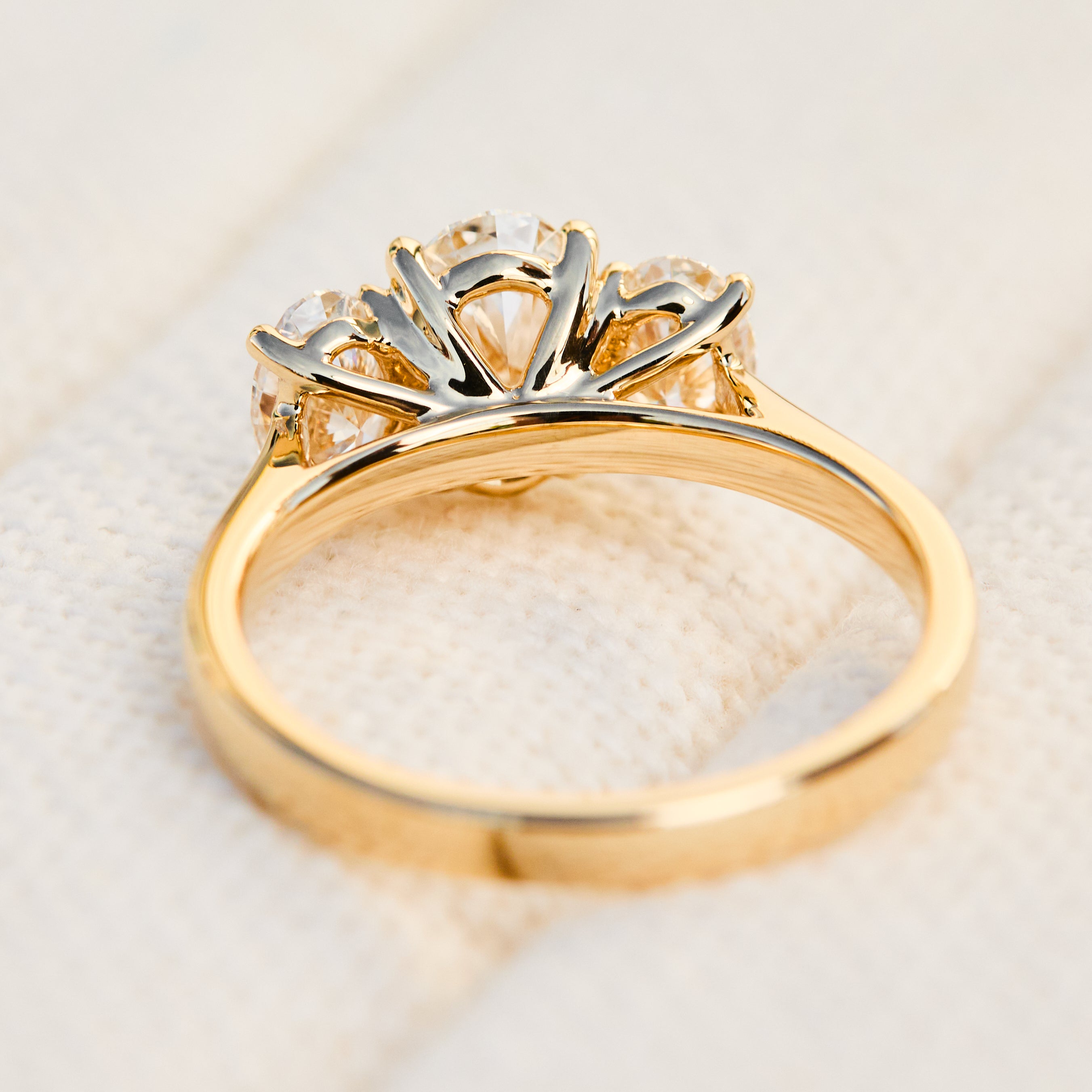 oval diamonds trilogy engagement ring set in 18ct yellow gold