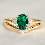 oval emerald yellow gold engagement ring stack