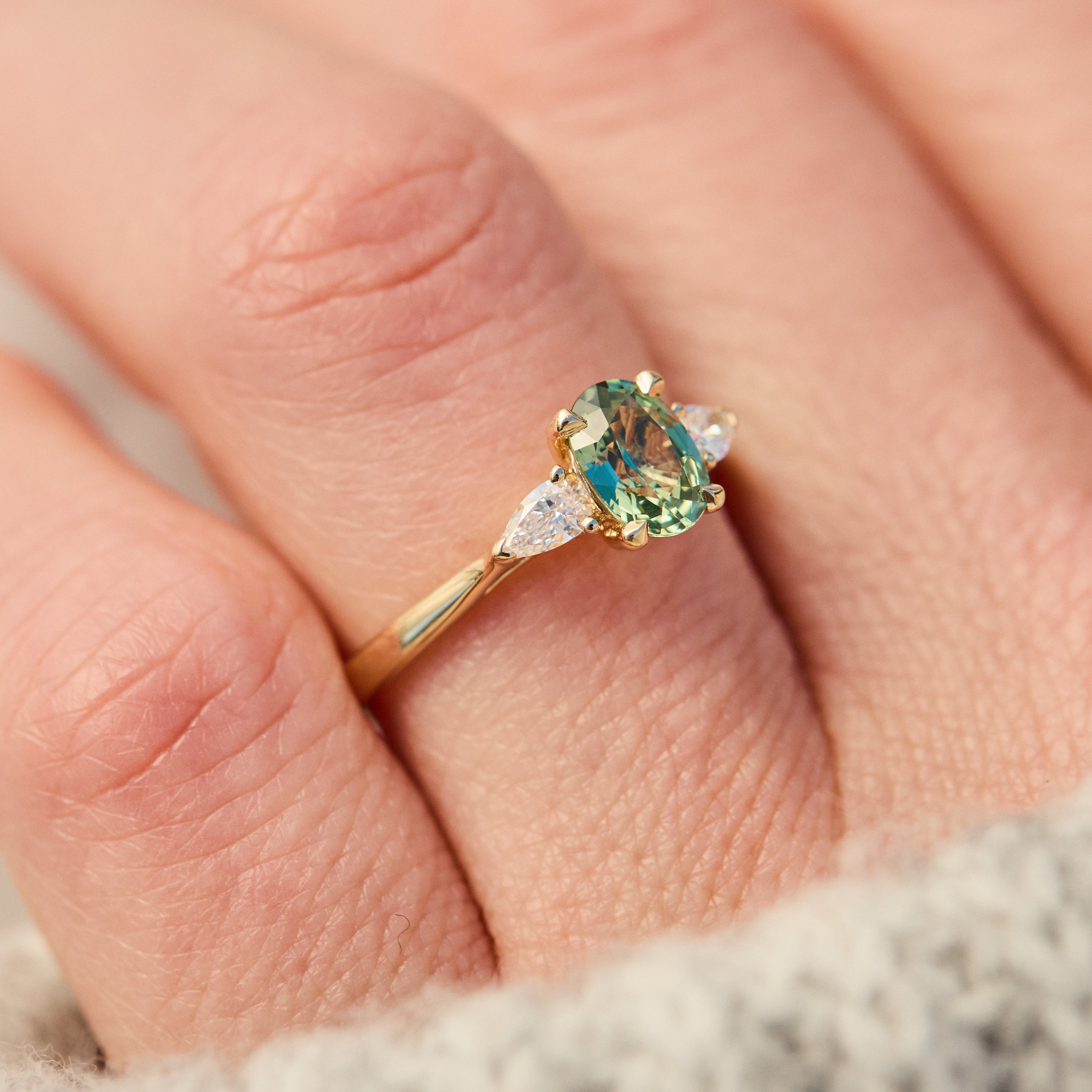 oval green sapphire engagement ring in yellow gold uk