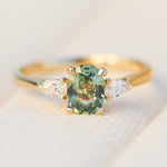 oval green sapphire engagement ring yellow gold