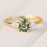 oval green sapphire engagement ring yellow gold