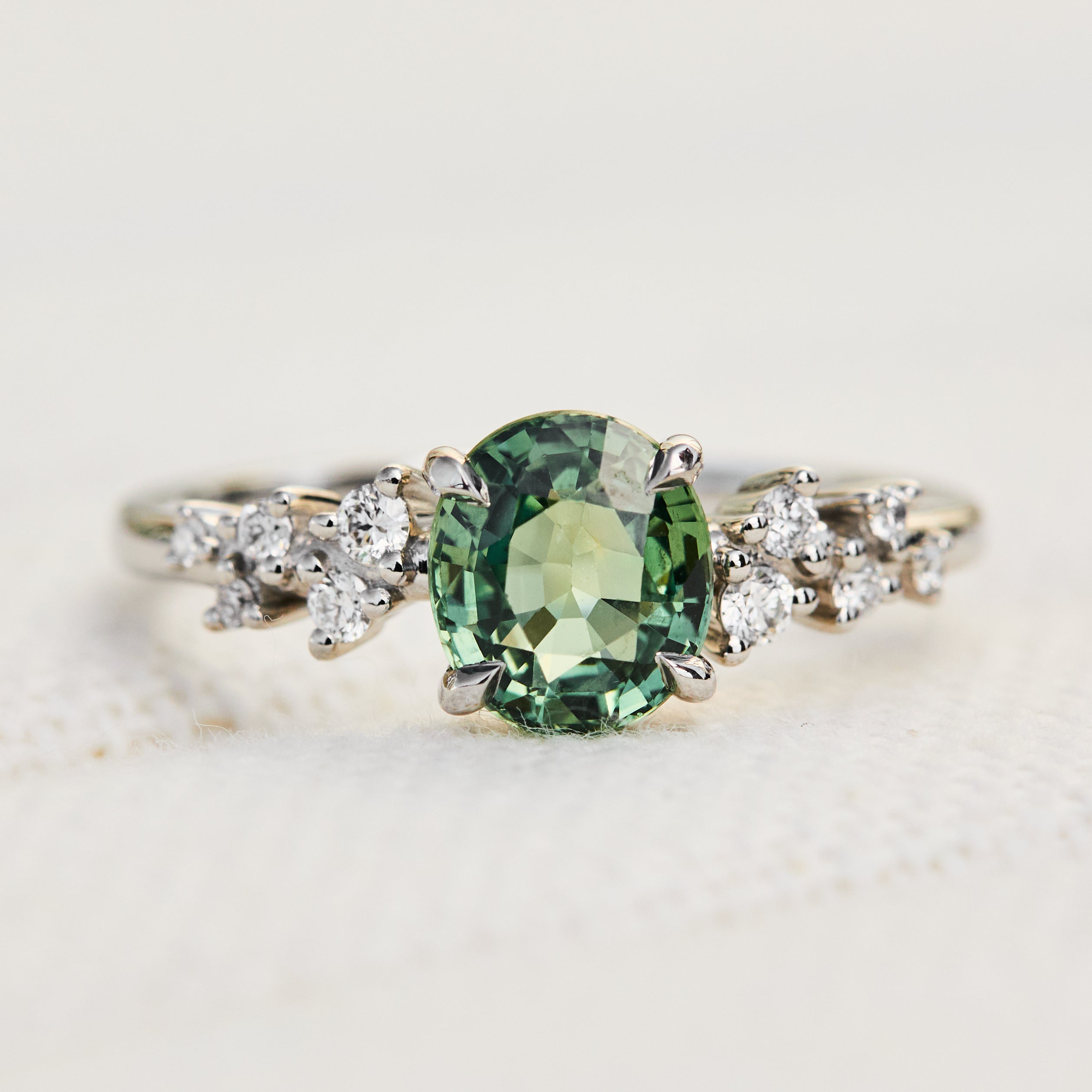 oval green sapphire platinum engagement ring