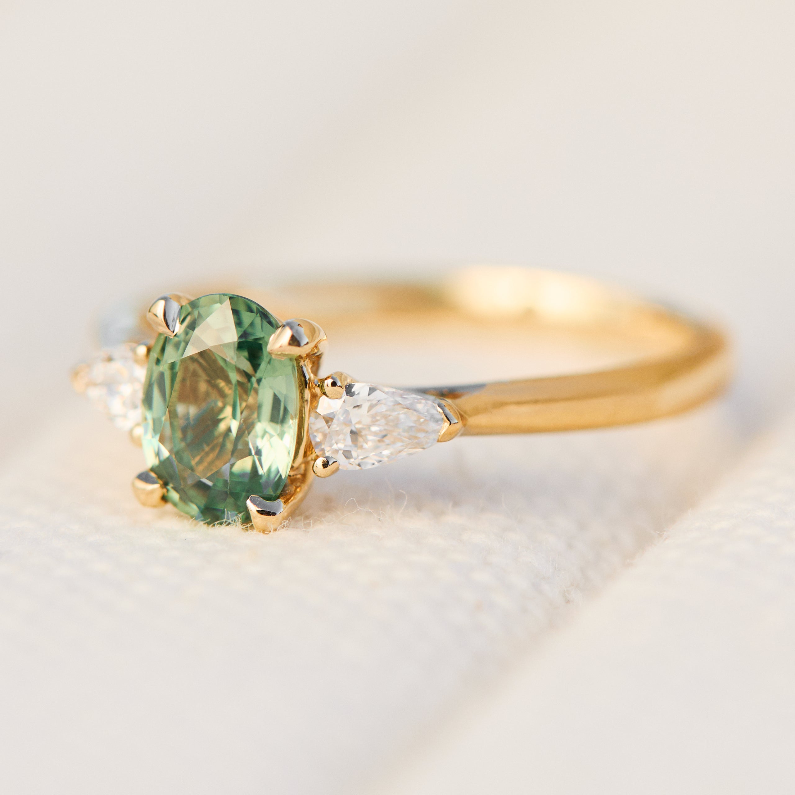 oval green sapphire engagement ring yellow gold