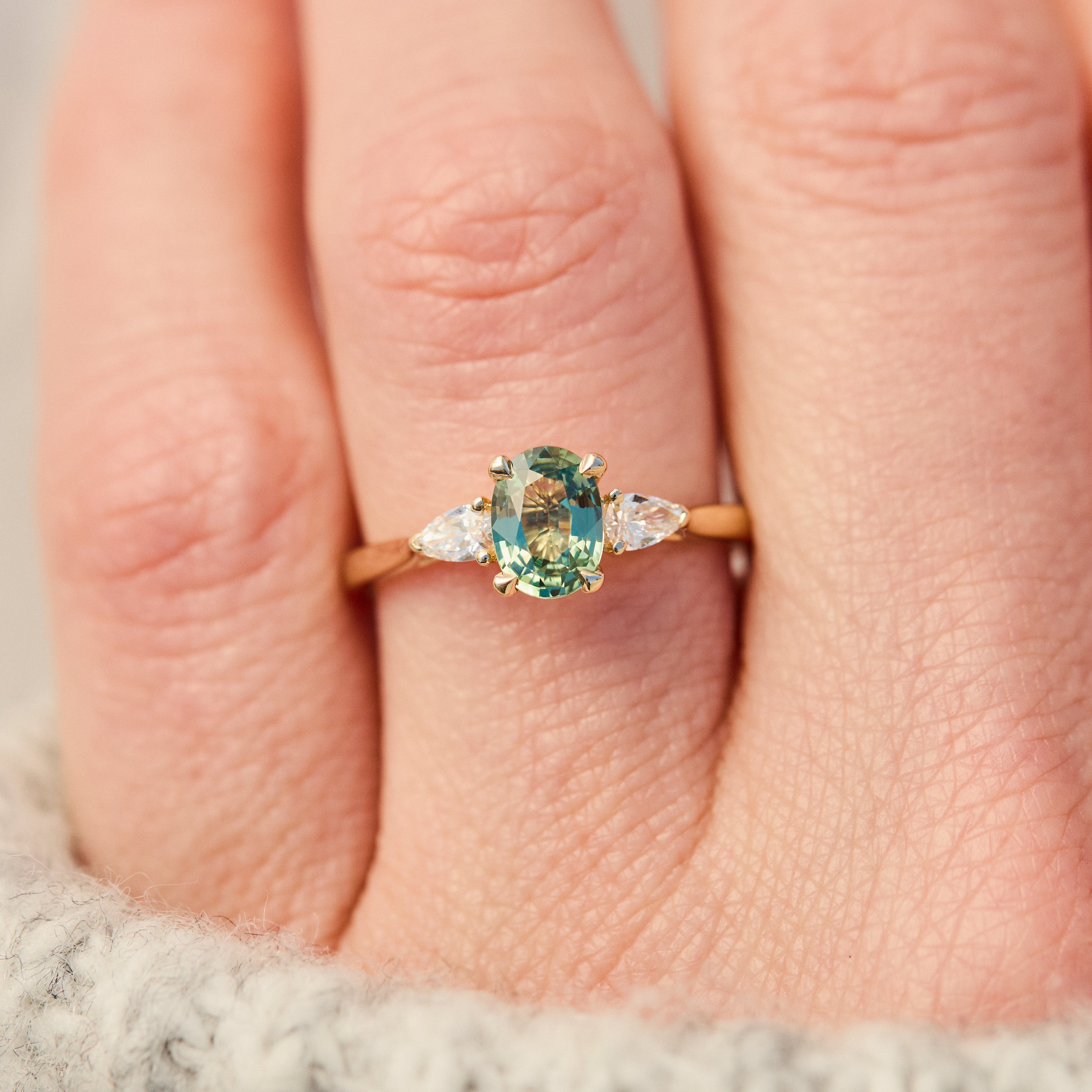 oval green sapphire engagement ring yellow gold