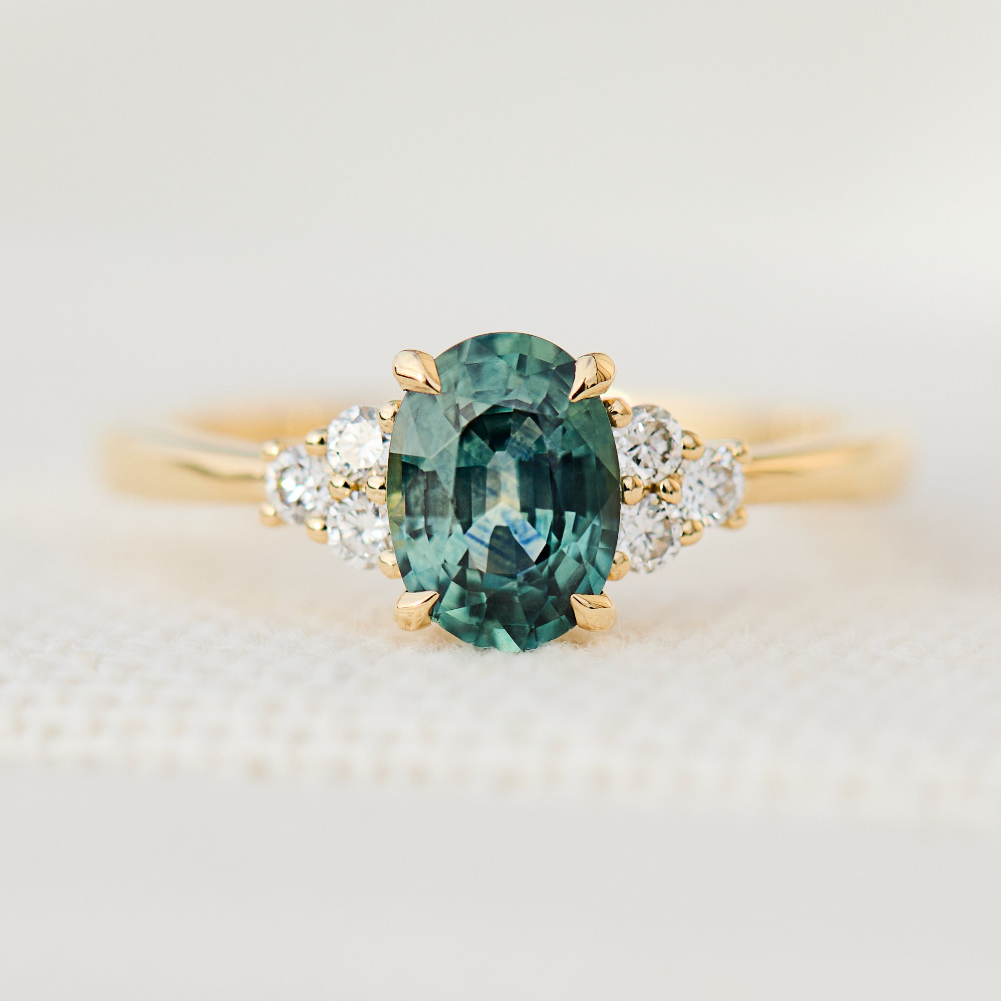 oval green teal sapphire ring