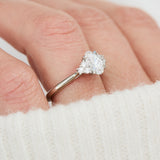 oval lab grown diamond ring in platinum paired with six round brilliant side diamonds