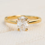 oval lab grown diamond yellow gold engagement ring