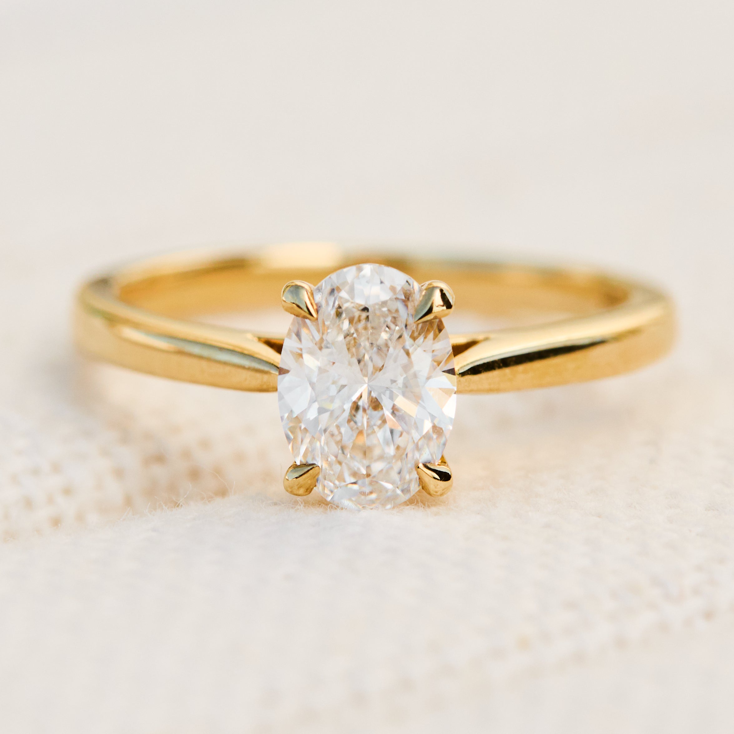 oval lab grown diamond yellow gold engagement ring