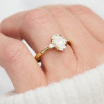 oval lab grown diamond yellow gold trilogy engagement ring