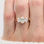 oval diamonds trilogy engagement ring set in 18ct yellow gold