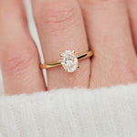 oval lab grown diamond engagement ring in yellow gold