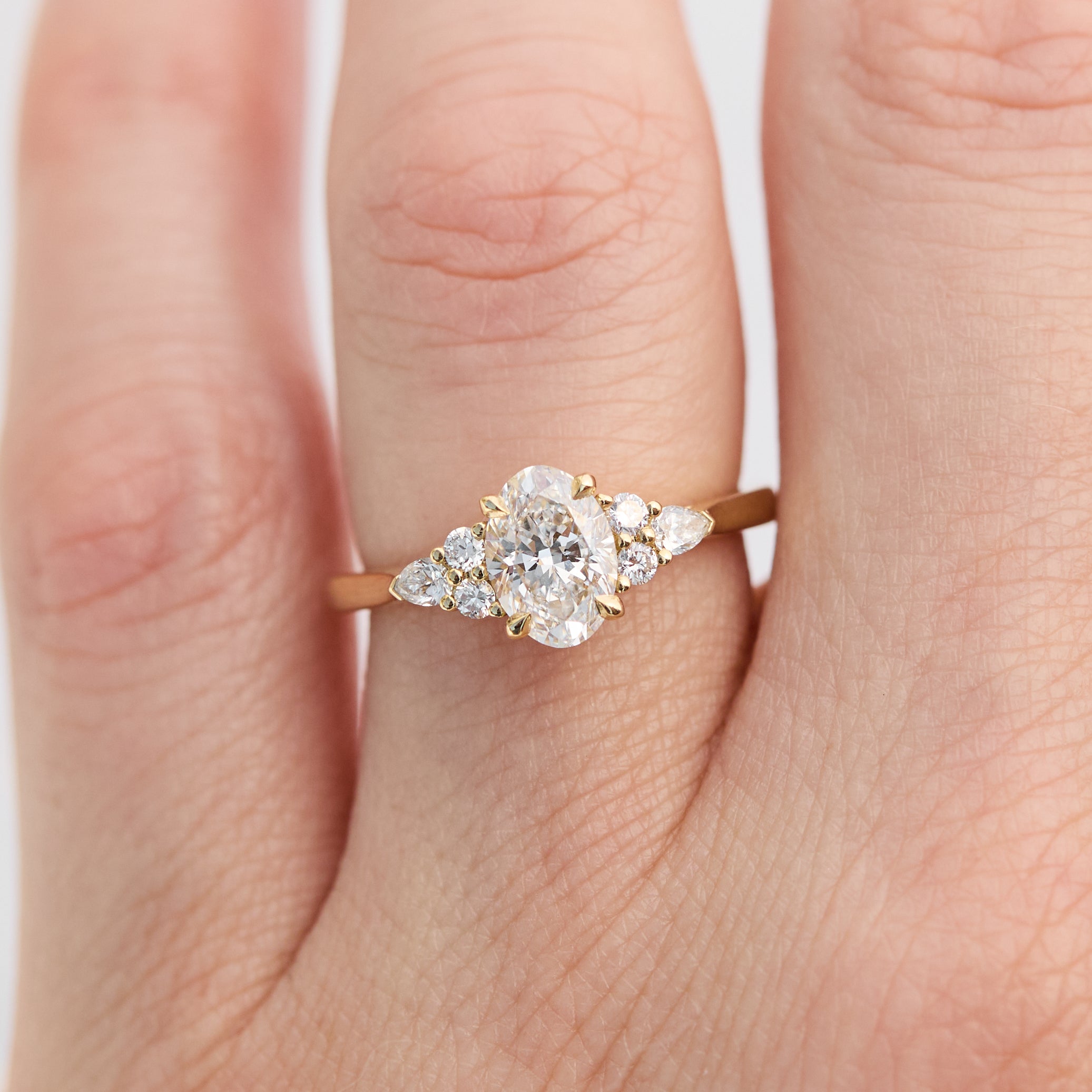 oval lab grown diamond engagement ring set in 18ct yellow gold