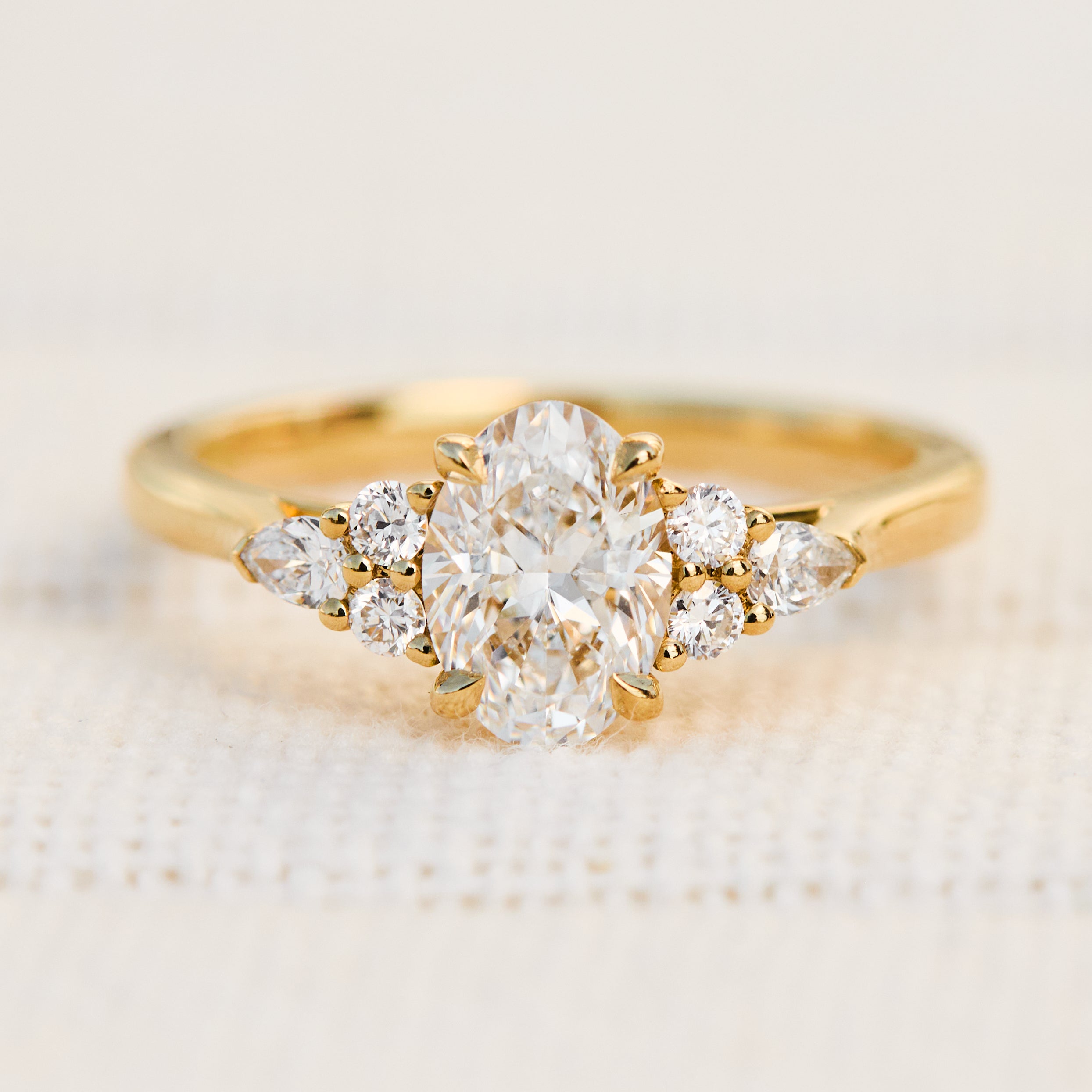 oval lab grown diamond engagement ring set in 18ct yellow gold