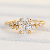 oval lab grown diamond engagement ring set in timeless yellow gold