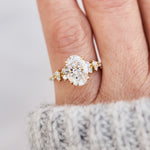 oval lab grown diamond yellow gold engagement cluster ring