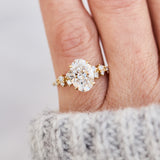 oval lab grown diamond yellow gold engagement cluster ring